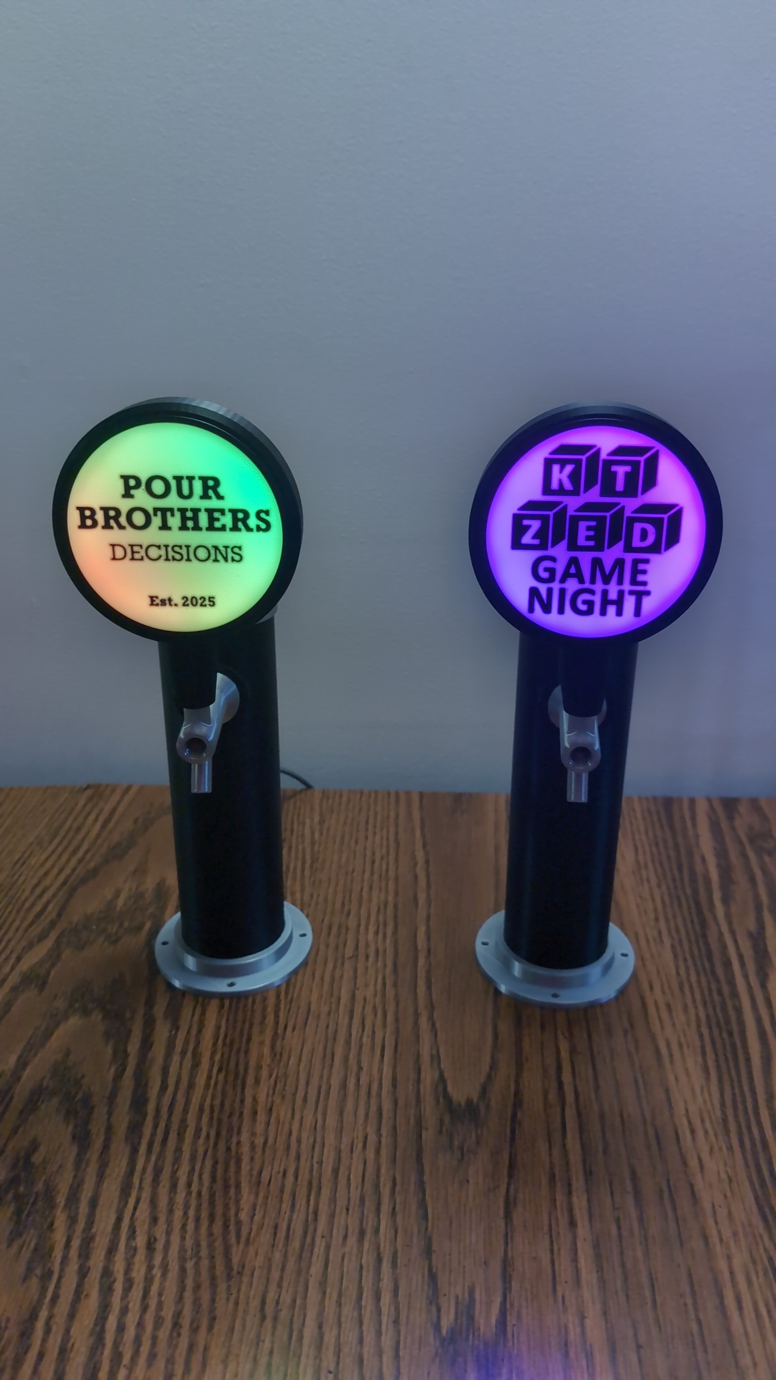 Custom glowing tap handles on a bar top